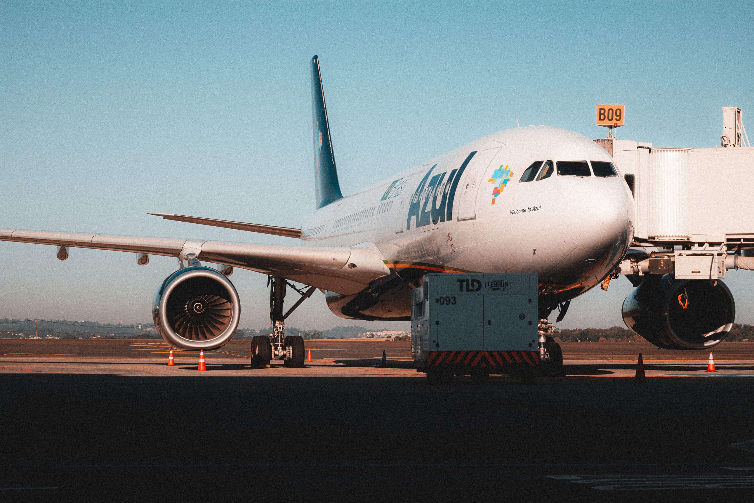 737plane landing at airport with Azul Airlines branding, focus on international travel and airline services.