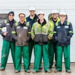 工程工人團隊合照，展現多元國際外勞，專業外派服務與全球人力資源管理。.