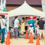 大阪世紀全球外勞集團活動現場，展示多元文化交流與科技互動。.